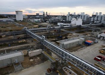 BASF shares indicated 3% lower as impairments drag earnings lower