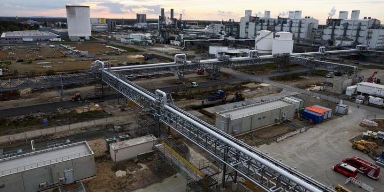 BASF shares indicated 3% lower as impairments drag earnings lower